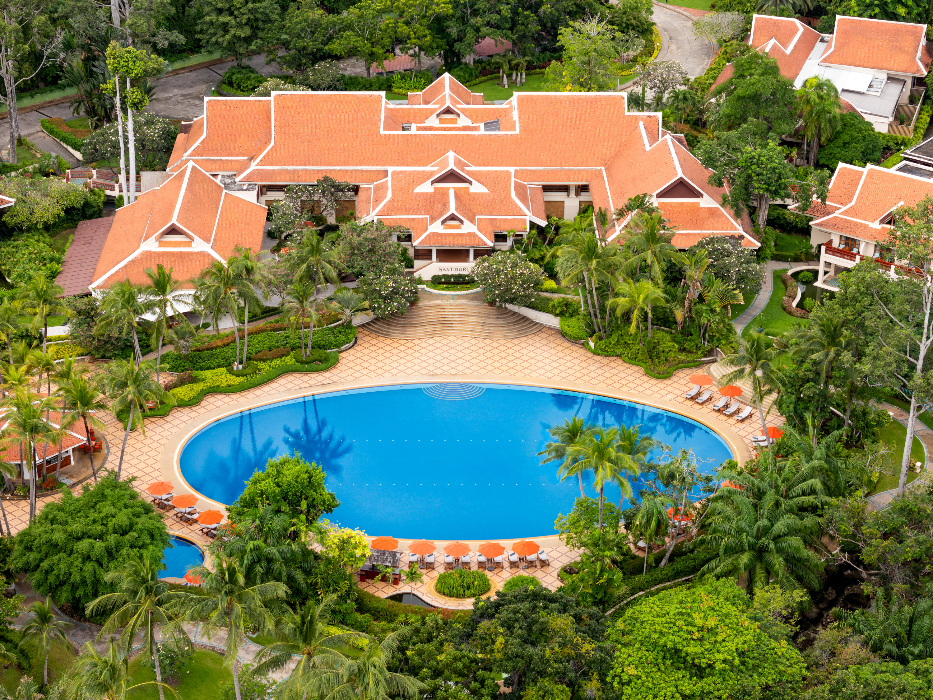 Aerial view of Santiburi Koh Samui resort and swimming pool surrounded by tropical gardens