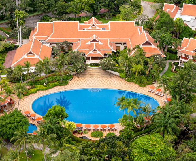 Aerial view of Santiburi Koh Samui resort and swimming pool surrounded by tropical gardens