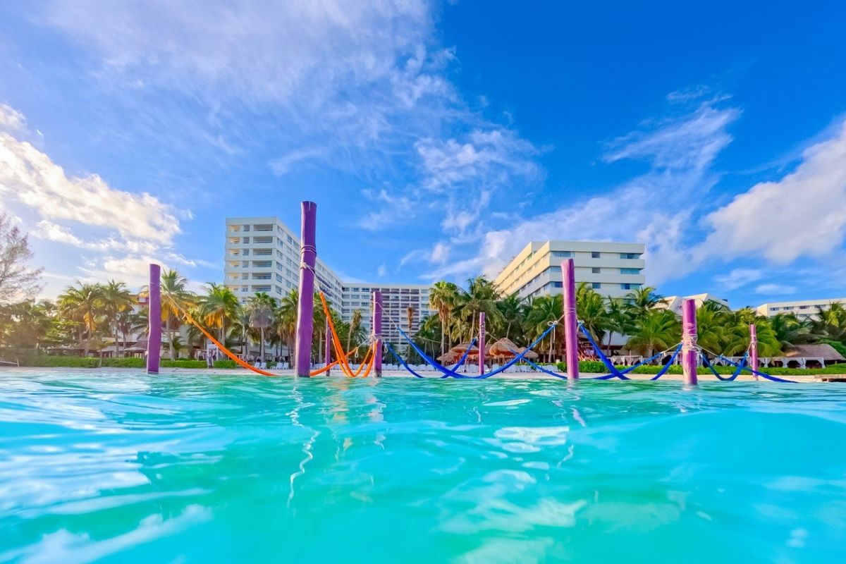 The Sens Cancun By Oasis tropical pool and resort surroundings