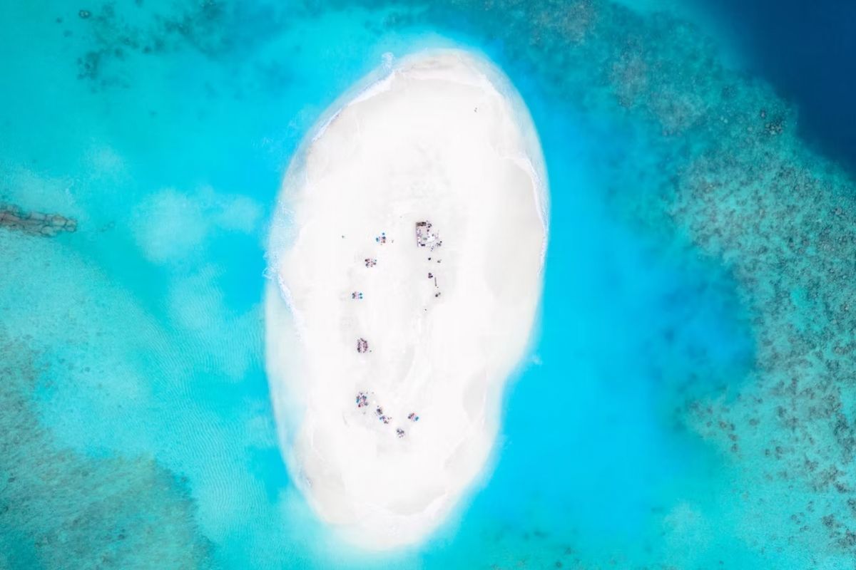 White sand island and turquoise lagoon at You & Me Cocoon Maldives