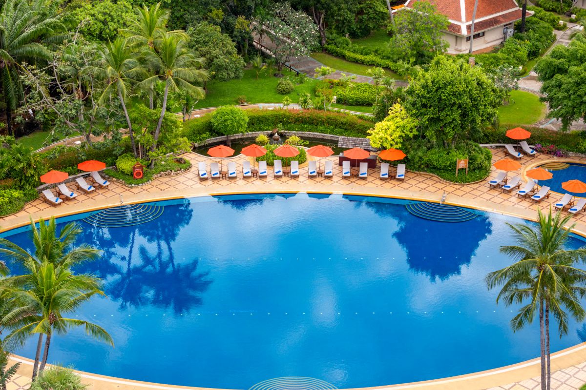 Large swimming pool surrounded by tropical gardens at Santiburi Koh Samui