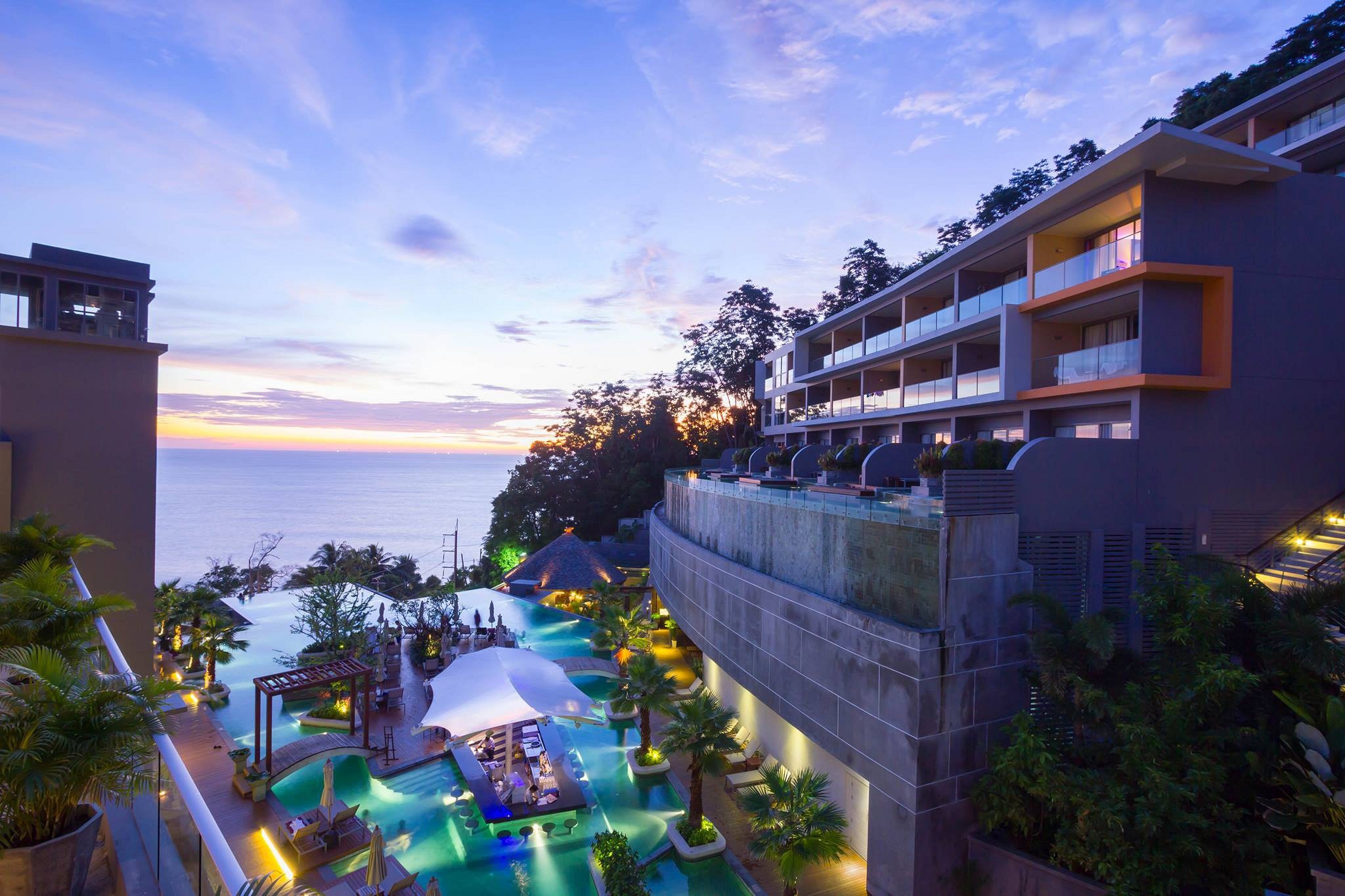 Kalima Resort & Spa Phuket infinity pool overlooking the Andaman Sea at sunset