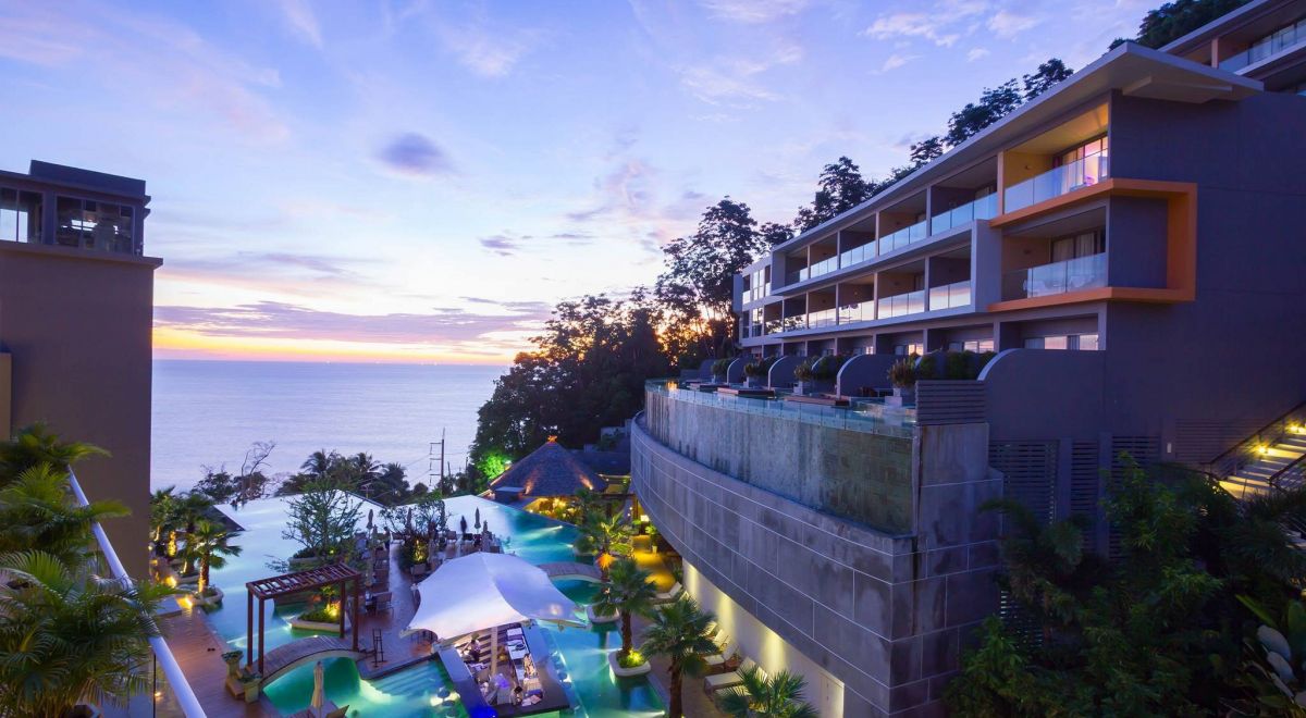Kalima Resort & Spa Phuket infinity pool overlooking the Andaman Sea at sunset