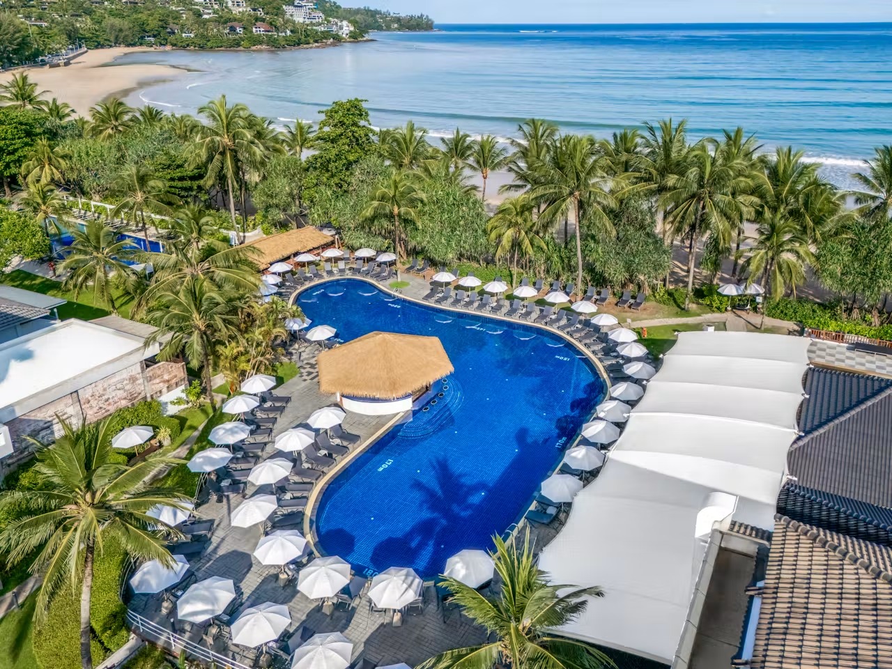 Swimming pool and tropical gardens at Sunprime Kamala Beach Resort Phuket