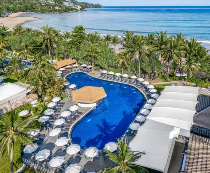 Swimming pool and tropical gardens at Sunprime Kamala Beach Resort Phuket