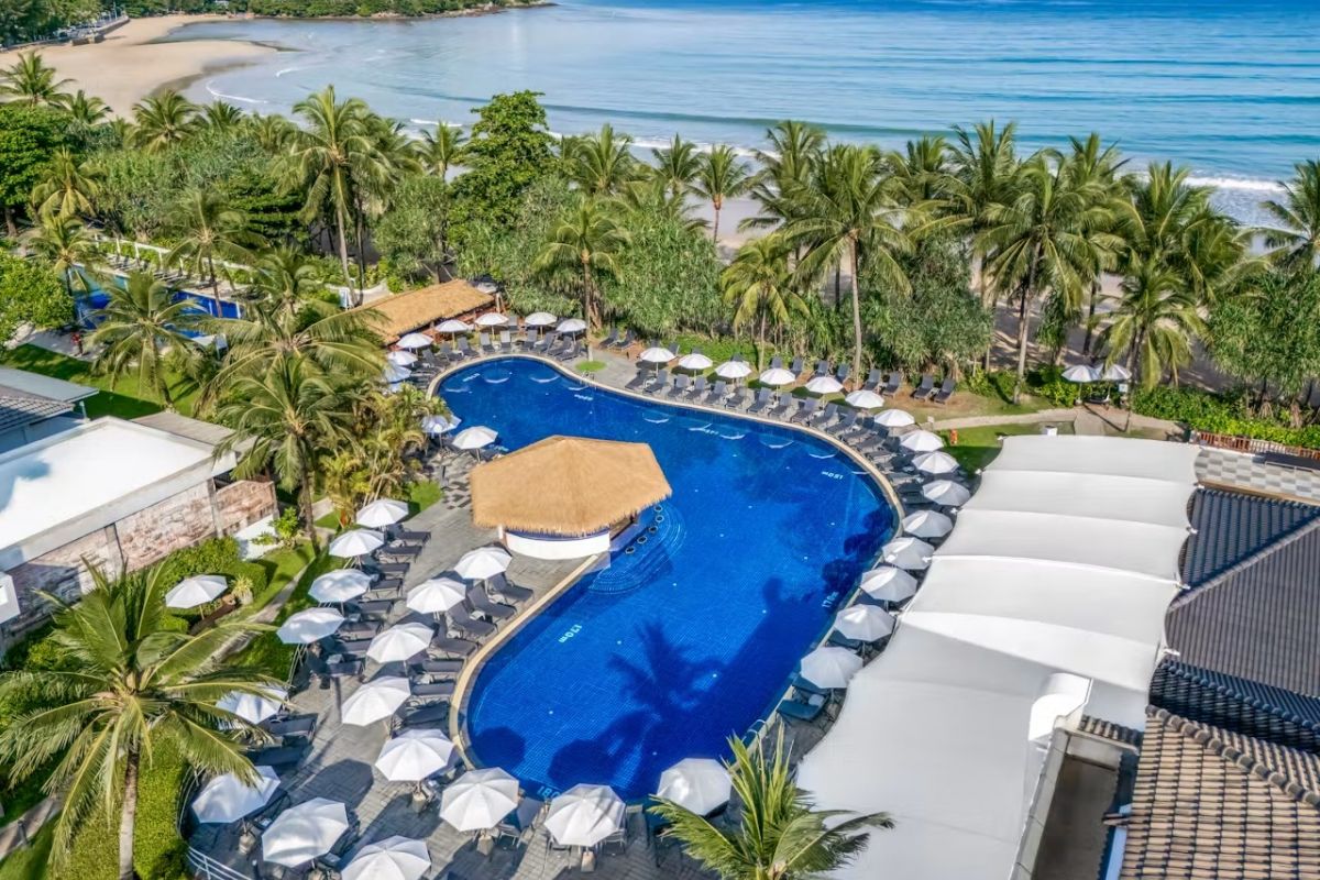 Swimming pool and tropical gardens at Sunprime Kamala Beach Resort Phuket