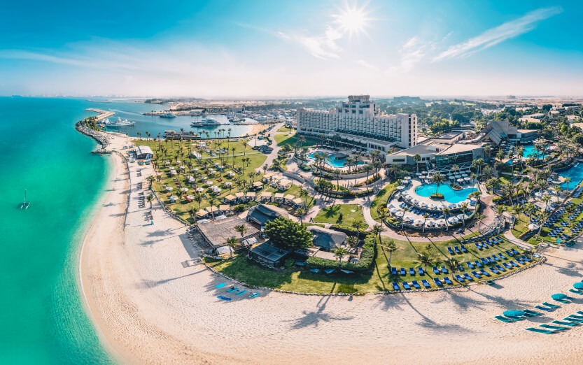 JA Beach Hotel Dubai aerial view with private beach and resort