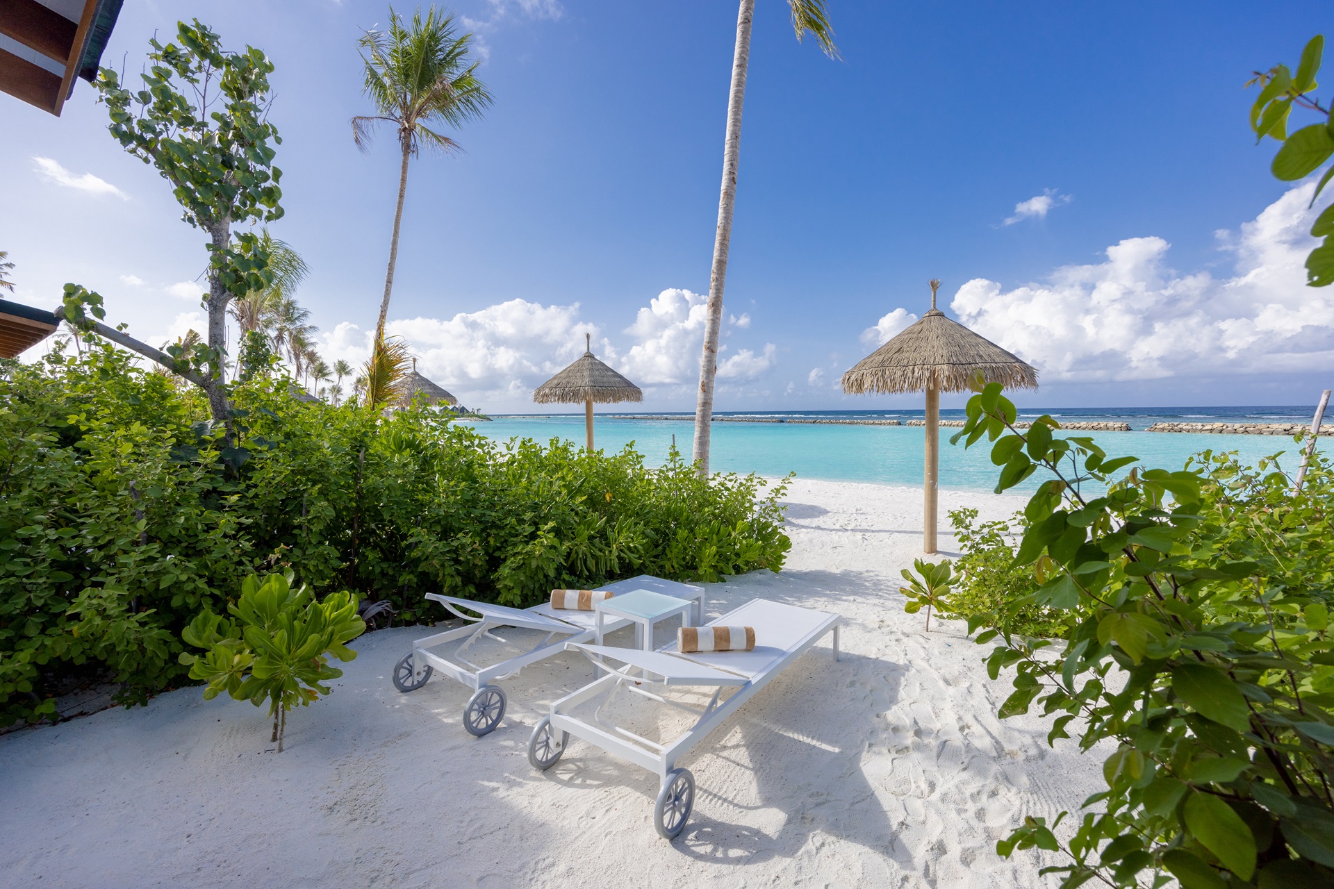 Joy Island Maldives Beach Villa exterior with tropical garden and sea view