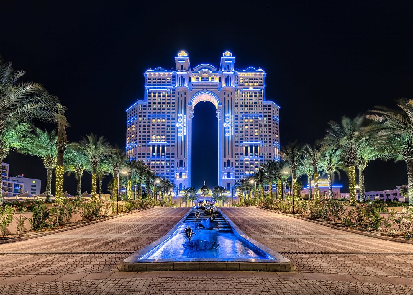 Rixos Marina Abu Dhabi illuminated at night