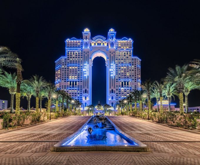 Rixos Marina Abu Dhabi illuminated at night
