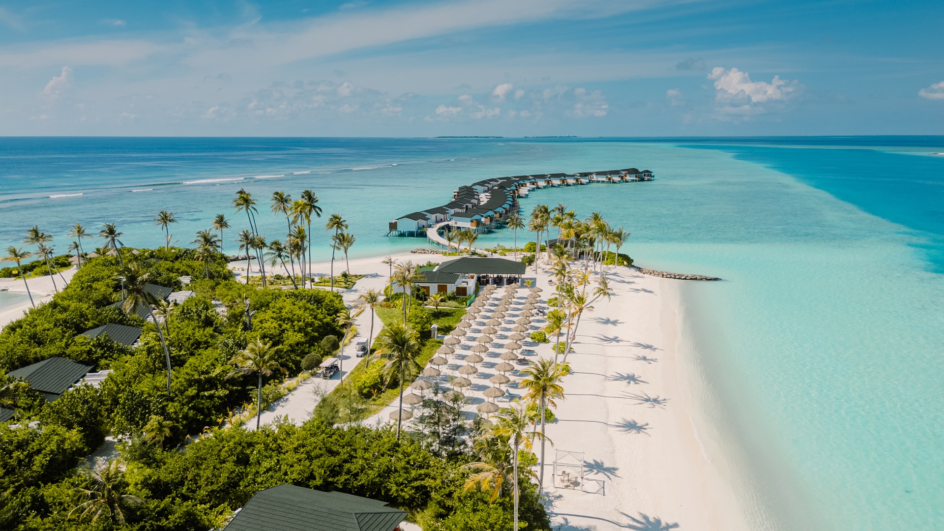 Joy Island Maldives aerial view with white sandy beach and turquoise lagoon