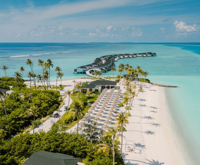 Joy Island Maldives aerial view with white sandy beach and turquoise lagoon