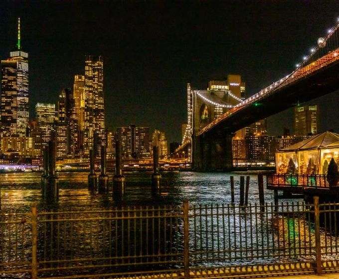 New York City skyline and Brooklyn Bridge at night