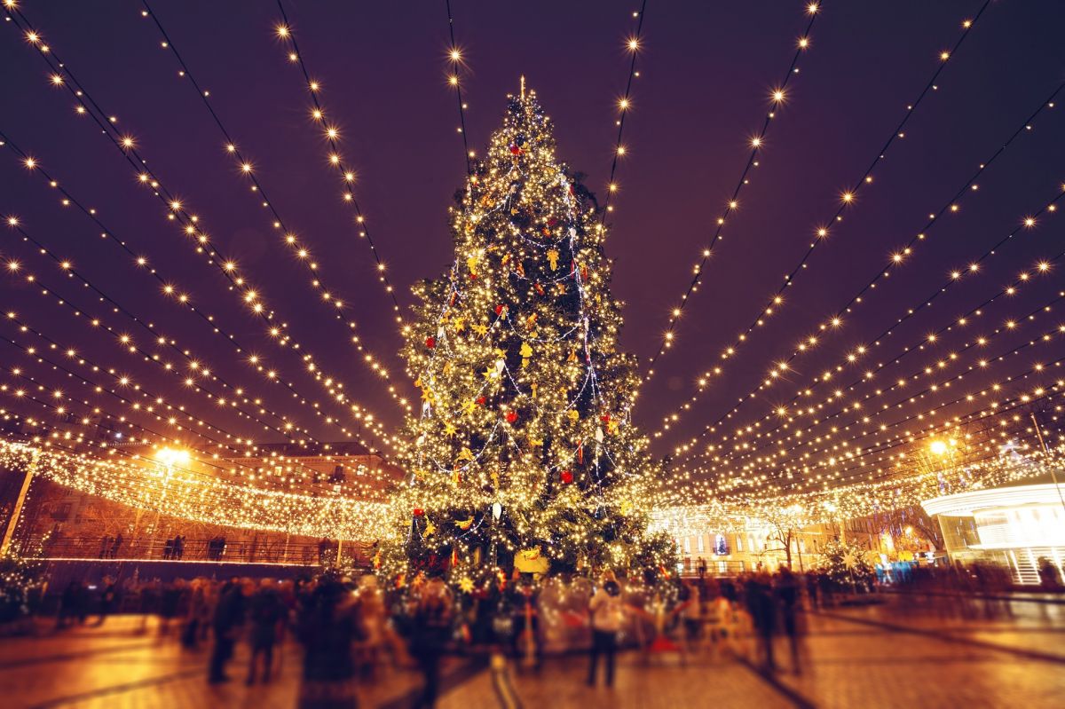 Christmas market with festive lights and decorated Christmas tree