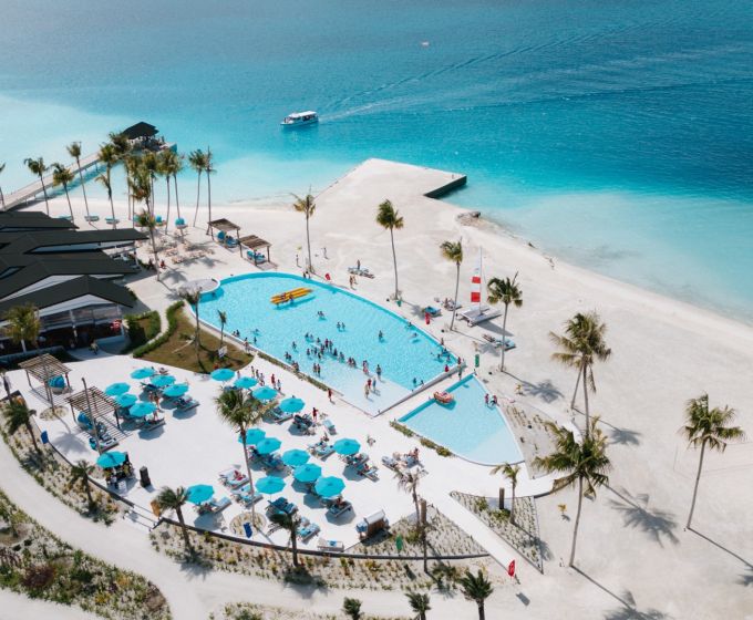 Joy Island Maldives resort aerial view with swimming pool and beach
