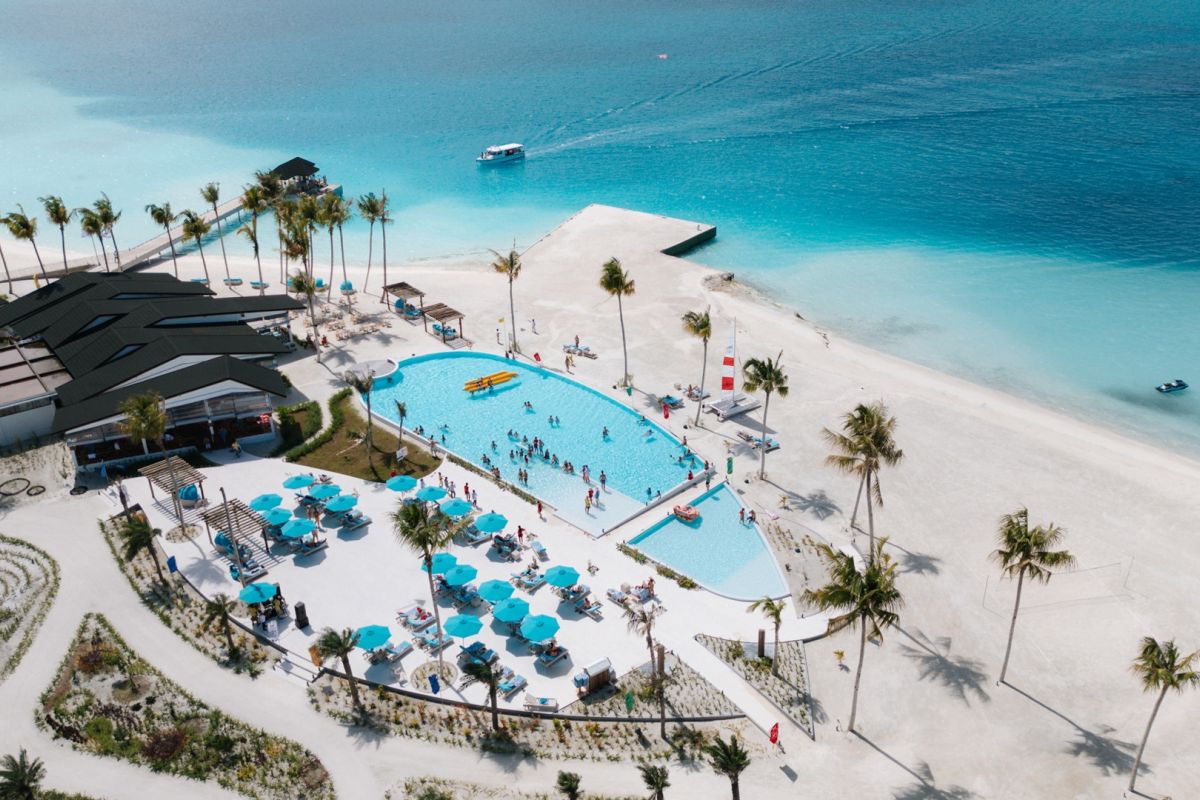 Joy Island Maldives resort aerial view with swimming pool and beach