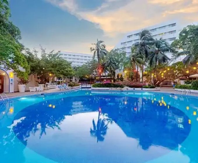 The Sens Cancun By Oasis swimming pool surrounded by tropical gardens