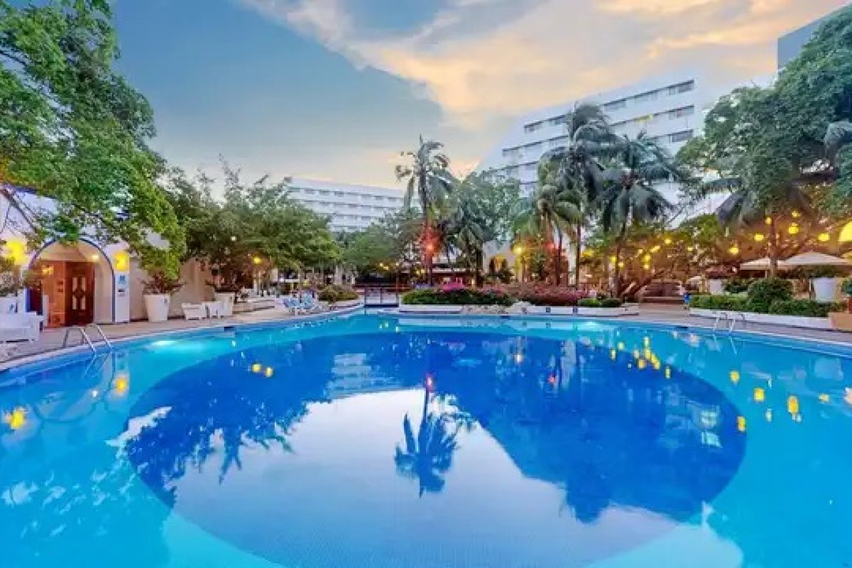 The Sens Cancun By Oasis swimming pool surrounded by tropical gardens