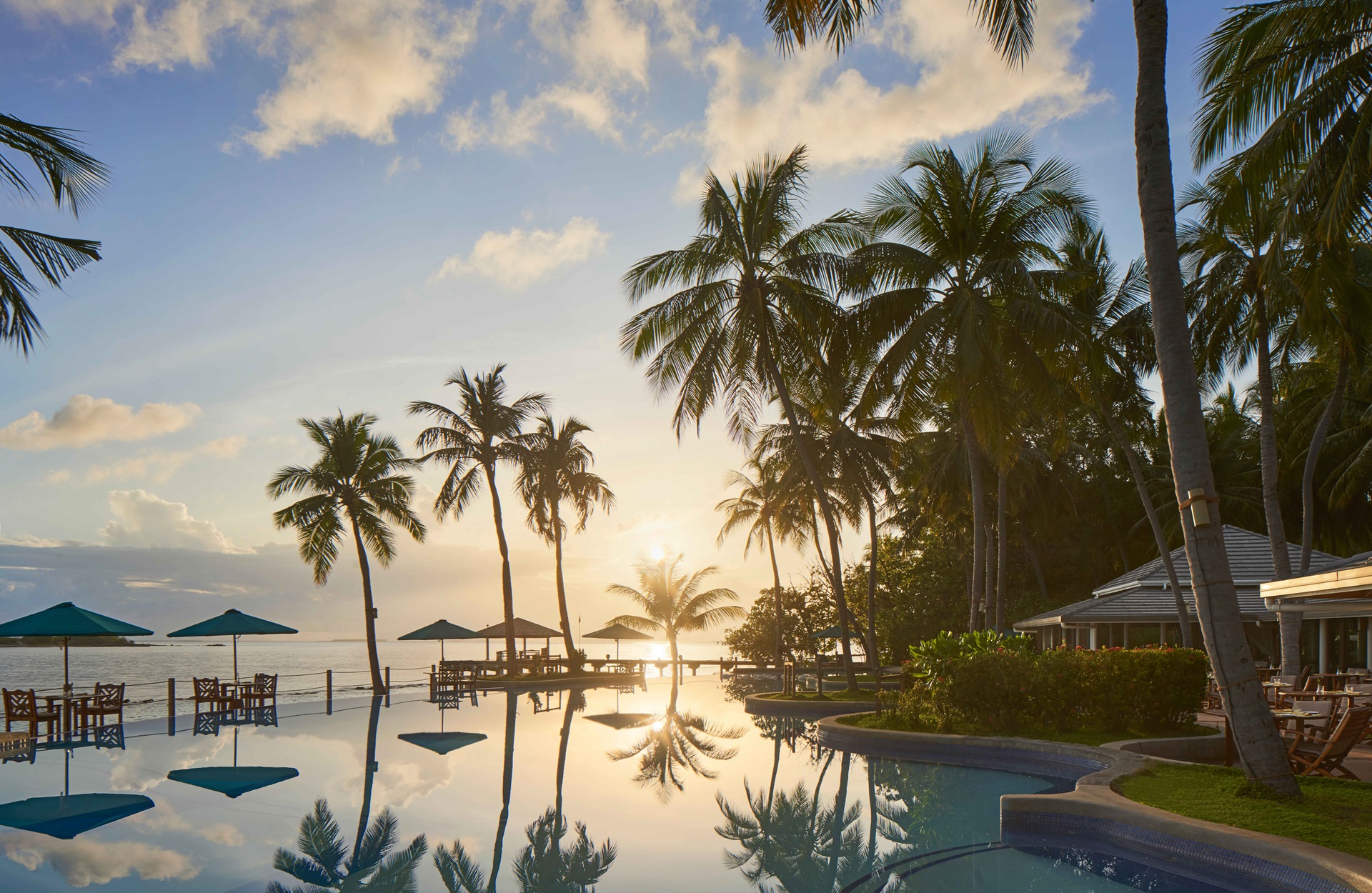Royal Island Maldives resort pool at sunset