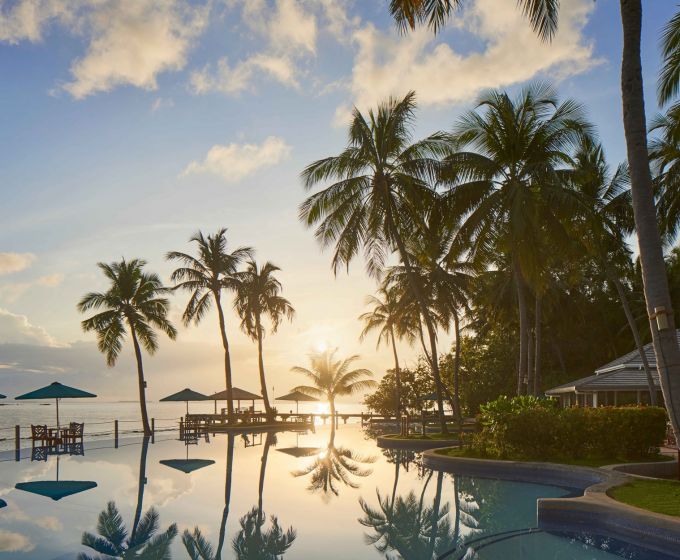 Royal Island Maldives resort pool at sunset