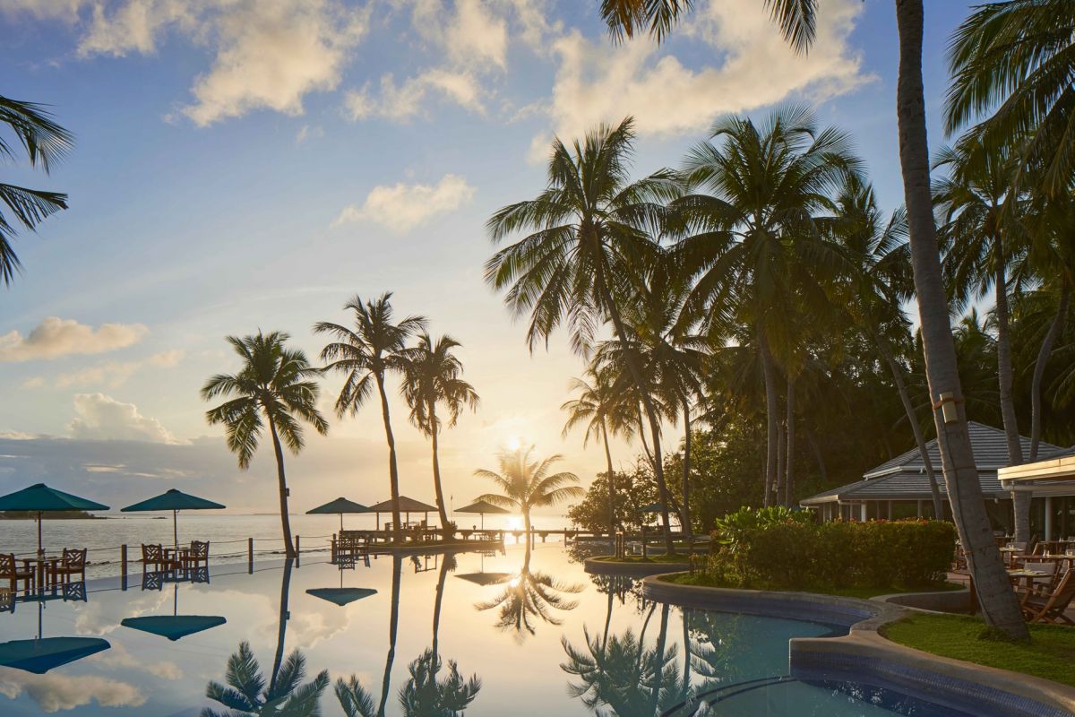 Royal Island Maldives resort pool at sunset
