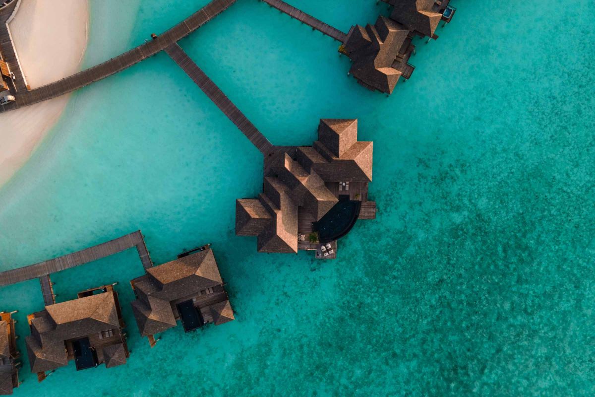 Sun Siyam Iru Fushi Aqua Retreat surrounded by turquoise lagoon