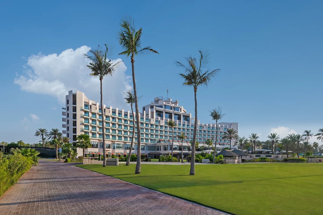 JA Beach Hotel Dubai exterior surrounded by landscaped gardens