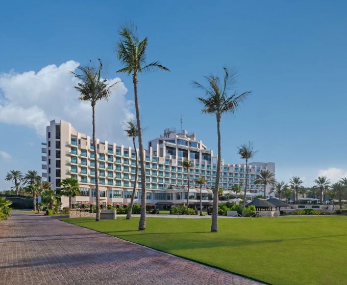 JA Beach Hotel Dubai exterior surrounded by landscaped gardens