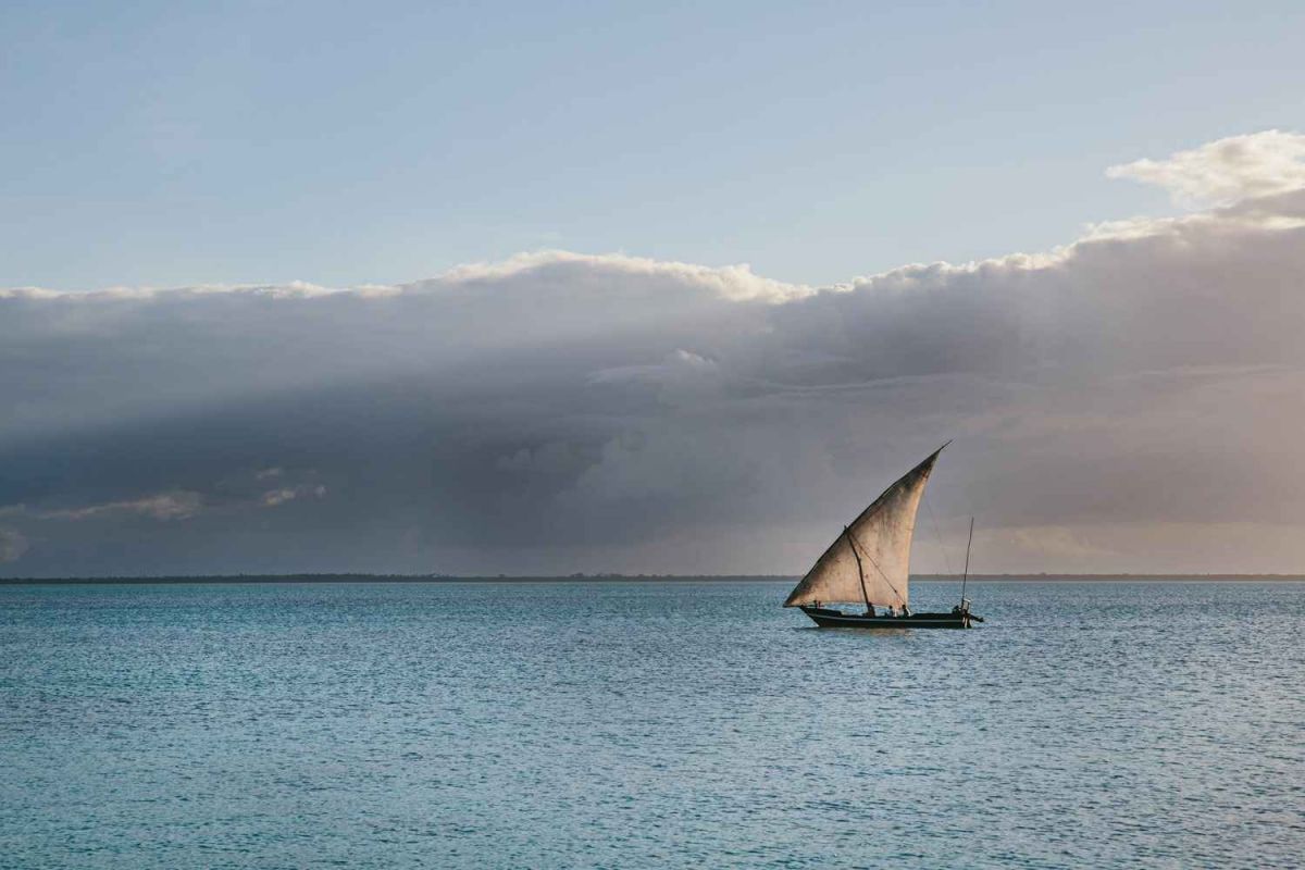 Traditional dhow sailing at sunset in Zanzibar